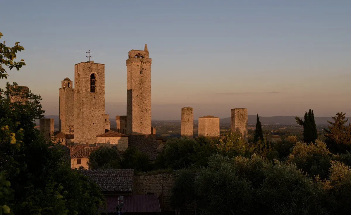 The towers of San Gimignano at sunset, a base for truffle hunting in Tuscany